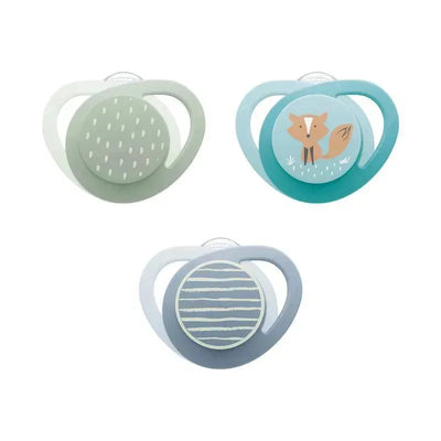 Three Nuk pacifiers in pastel colors, featuring playful designs including a fox, and abstract patterns. Size 3.