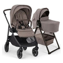 Nuna BMW Swiv Stroller with a removable Umber fabric bassinet and stand, designed for infants and toddlers.