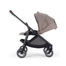 Nuna BMW swivel stroller in Umber with a soft fabric seat, adjustable canopy, and sleek black frame.