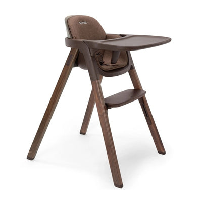 Nuna BRYN High Chair in Clove color, featuring a comfortable seat, armrest, and sturdy wooden legs.