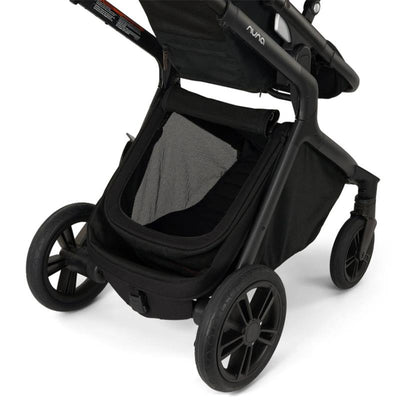 Nuna DEMI™ icon stroller in Caviar, showcasing the undercarriage storage area and rear wheels.