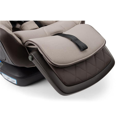 Nuna EXEC™ next All-in-One Car Seat in Biscotti color, featuring a quilted brown base and a foldable padded seat cover.