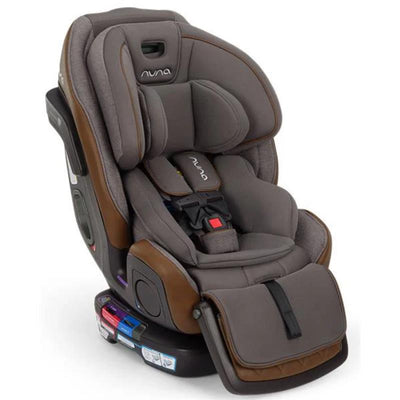 Nuna EXEC™ next All-in-One Car Seat in granite gray, featuring a padded seat, adjustable harness, and safety labels.