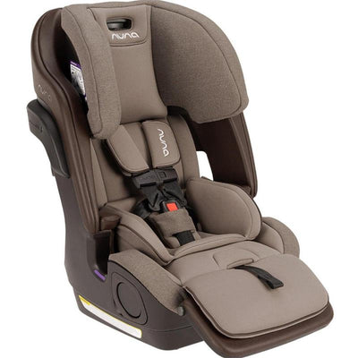 Nuna LUMN Combination Car Seat in Cedar color features a padded design with adjustable headrest and harness system.