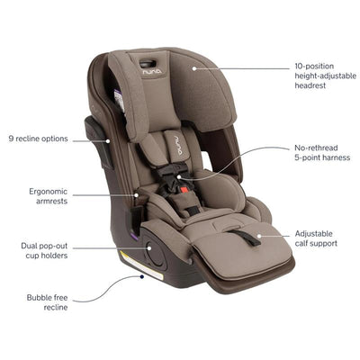 Nuna LUMN Combination Car Seat in Cedar with a height-adjustable headrest, 5-point harness, and dual pop-out cup holders.