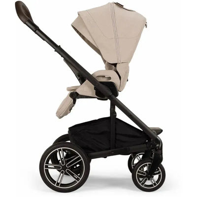 Nuna MIXX™ next stroller in Biscotti color with magnetic buckle features a luxurious seat and sturdy frame.