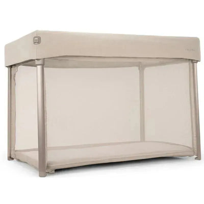 Nuna PAAL™ Playard in Biscotti color, featuring a mesh fabric enclosure and sturdy frame, ideal for portable infant play.