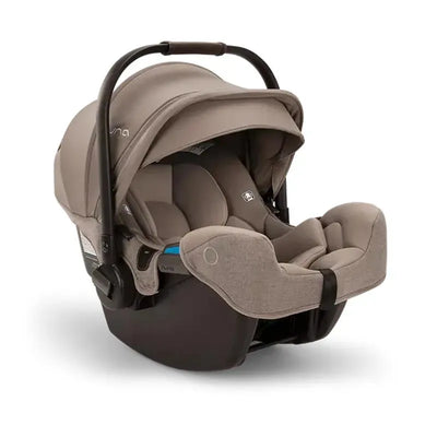 Nuna PIPA™ aire rx Infant Car Seat in Cedar color, featuring a spacious seat, adjustable canopy, and safety harness.
