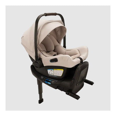 Beige infant car seat with canopy attached to a black ISOFIX base.