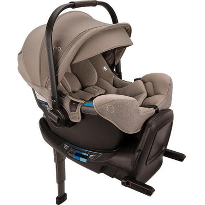 Nuna PIPA™ rx infant car seat in Cedar color, featuring a RELX base, adjustable canopy, and safety harness.