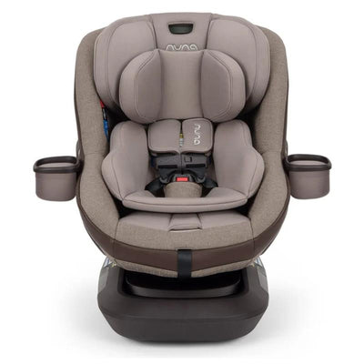Nuna REVV™ maxx Convertible Car Seat in Cedar color with plush fabric, side cup holders, and adjustable headrest.
