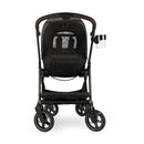 Nuna Swiv + Pipa Aire Rx travel system in caviar/chocolate color, featuring a sleek stroller with a cup holder and ample storage.
