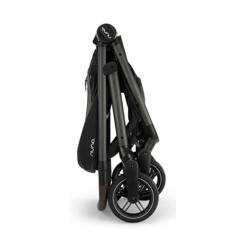 Nuna Swiv stroller, folded and compact, features sleek black design with logo on handle, ideal for travel.