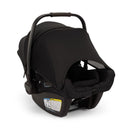 Nuna Pipa Aire Rx infant car seat in caviar/chocolate color, featuring a sun canopy and safety labels on the side.