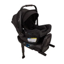 Nuna Pipa Aire Rx infant car seat in black, featuring a sleek design with safety labels and easy-install base.