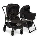 Nuna Swiv stroller with a black seat and wheels, alongside a black bassinet on a stand, both featuring sleek designs.