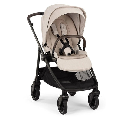 Nuna Swiv Stroller in Chai/Caviar color with a plush seat and adjustable canopy, designed for ease of use.