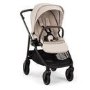 Nuna Swiv Stroller in Chai/Caviar color with a plush seat and adjustable canopy, designed for ease of use.