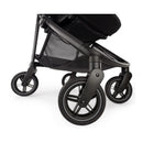 Black Nuna Swiv stroller showcasing its durable wheels and sleek design, emphasizing stability and maneuverability.