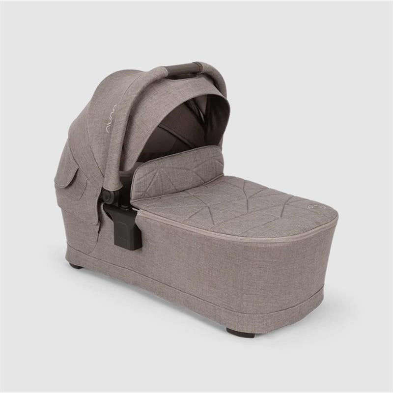 Nuna SWIV & TRIV Series Bassinet in Umber, featuring a padded interior and canopy for infant comfort.