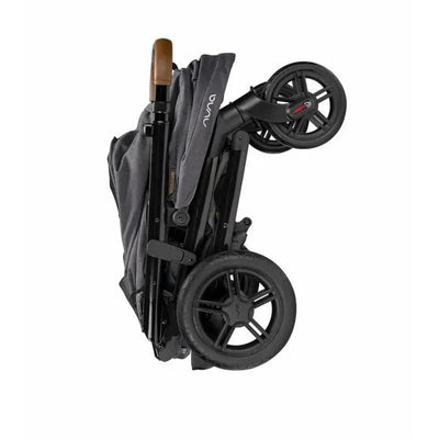 Nuna TAVO™ next Stroller folded in Granite color, featuring a sleek design and rubber wheels.