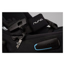 Nuna Triv Lx car seat buckle and harness detail, featuring a black fabric design with a blue accent.