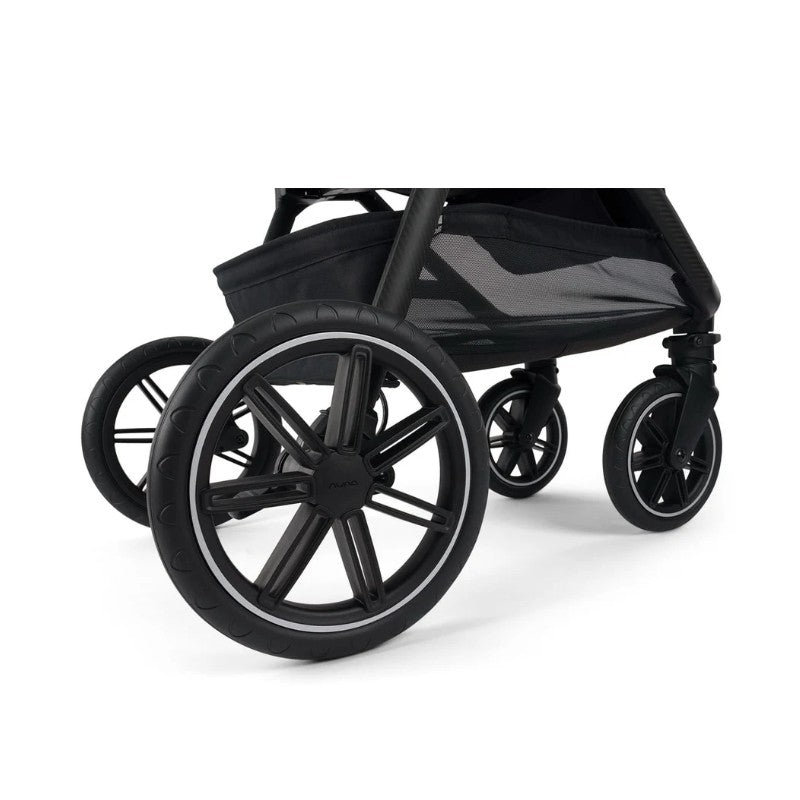 Black wheels of the Nuna Triv LX stroller, featuring a sleek design and sturdy construction, with a mesh storage basket visible.