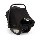 Nuna Triv Lx + Pipa Aire Rx Travel System in Caviar, featuring a sleek black car seat with a pull handle and safety labels.