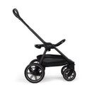 Nuna Triv Lx stroller in Cedar, featuring a black frame, large wheels, and a spacious undercarriage for storage.