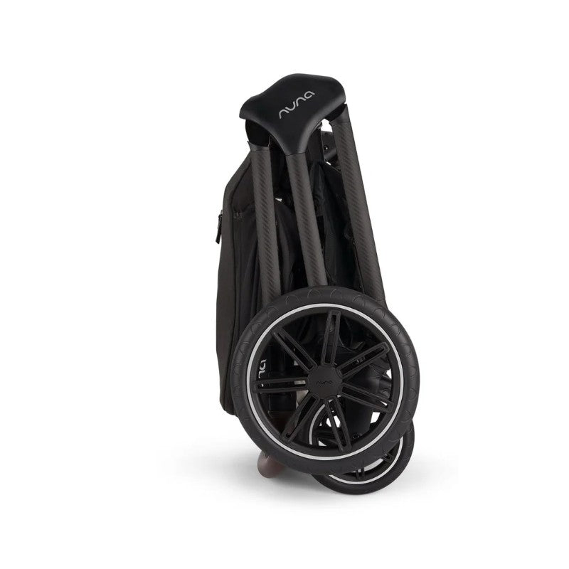Nuna Triv Lx travel system bundle in caviar color, showcasing the compactly folded stroller with visible wheels and handle.