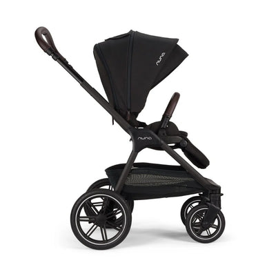Nuna Triv Lx stroller in caviar color, featuring a large canopy, adjustable handle, and a lower storage basket.