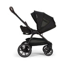 Nuna Triv Lx stroller in black, featuring a reclining seat, adjustable canopy, and spacious storage basket.