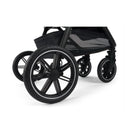 Black Nuna Triv Lx stroller wheels with sleek design and durable tires, showcasing stability and maneuverability.