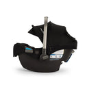Nuna Triv Lx + Pipa Rx travel system bundle in caviar, featuring a car seat with a black fabric canopy and safety labels.