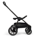 Nuna Triv Lx stroller in Cedar color, featuring a sleek design, large wheels, and a spacious storage basket.