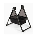 Nuna Triv bassinet stand in black, featuring a compact triangular design with mesh sides for ventilation.