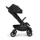 Nuna Trvl 360 Compact Stroller in Caviar color, features a sleek design with a tall canopy and brown handlebar.