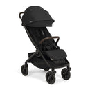 Nuna Trvl 360 Compact Stroller in Caviar color, featuring a black fabric seat and a brown handlebar, designed for easy transport.