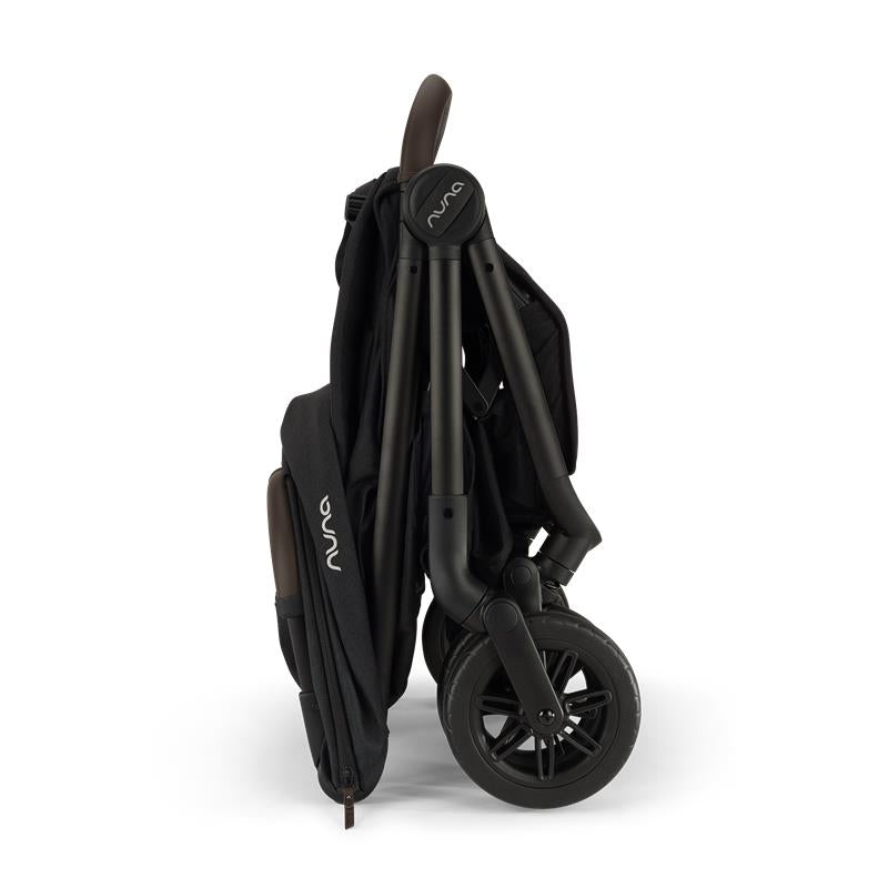 Nuna Trvl 360 Compact Stroller in Caviar color, folded and showcasing its sleek design and compact profile.