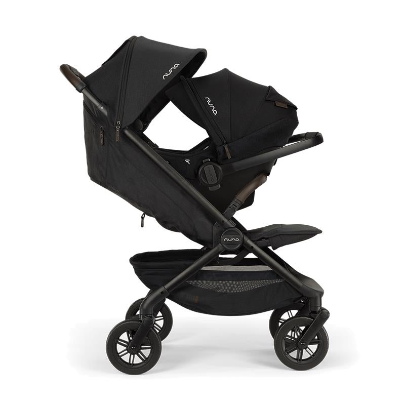 Nuna Trvl 360 Compact Stroller in Caviar, featuring a sleek black design and adjustable canopies for comfort.