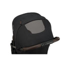 Nuna Trvl 360 Compact Stroller in Caviar color, featuring a stylish canopies with a mesh panel for ventilation.