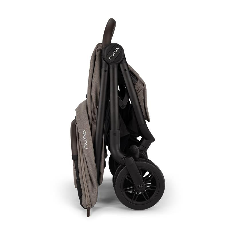 Nuna Trvl 360 Compact Stroller in Cedar, shown in a folded position, featuring a sleek design and black wheels.