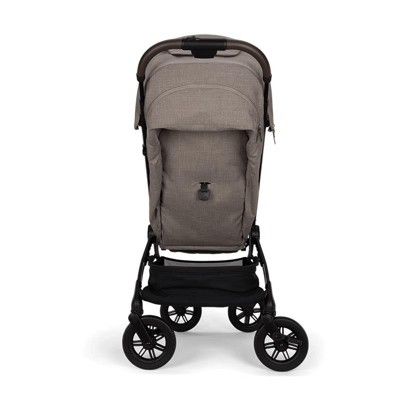 Nuna Trvl 360 Compact Stroller in Cedar color, featuring a sleek design, adjustable seat, and a lower storage basket.