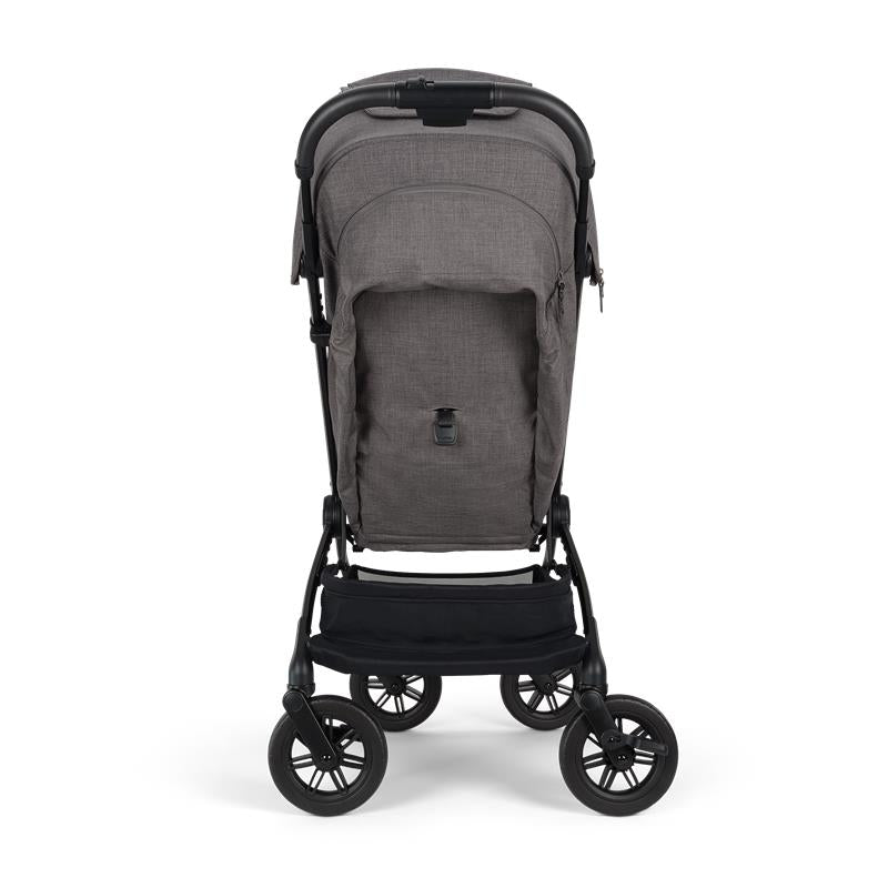 Nuna Trvl 360 Compact Stroller in pewter color, featuring a sleek design and sturdy wheels with a spacious lower storage basket.