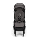 Nuna Trvl 360 Compact Stroller in pewter color, featuring a padded seat, adjustable canopy, and wheels for easy maneuverability.