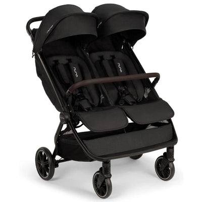 Lightweight Nuna TRVL Dubl side-by-side double stroller in caviar color, featuring two seats with adjustable canopies.