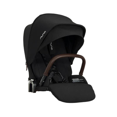 Nuna PIPA™ urbn Flex System Seat in Caviar color with a brown handle and adjustable hood, designed for infant safety.