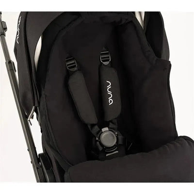 Nuna Winter Stroller Set in Caviar color, featuring a padded seat, safety harness, and plush fabric.