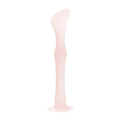 Diaper rash cream applicator with a suction base in coral color, designed for easy application.
