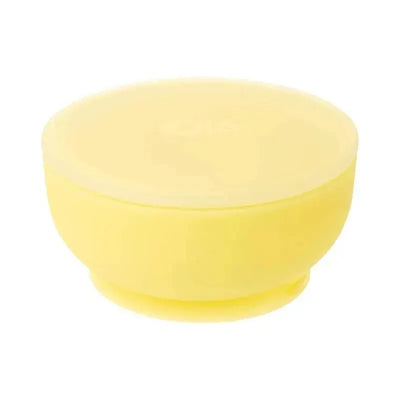 Suction bowl with lid in lemon color, ideal for children; features a smooth, rounded design.